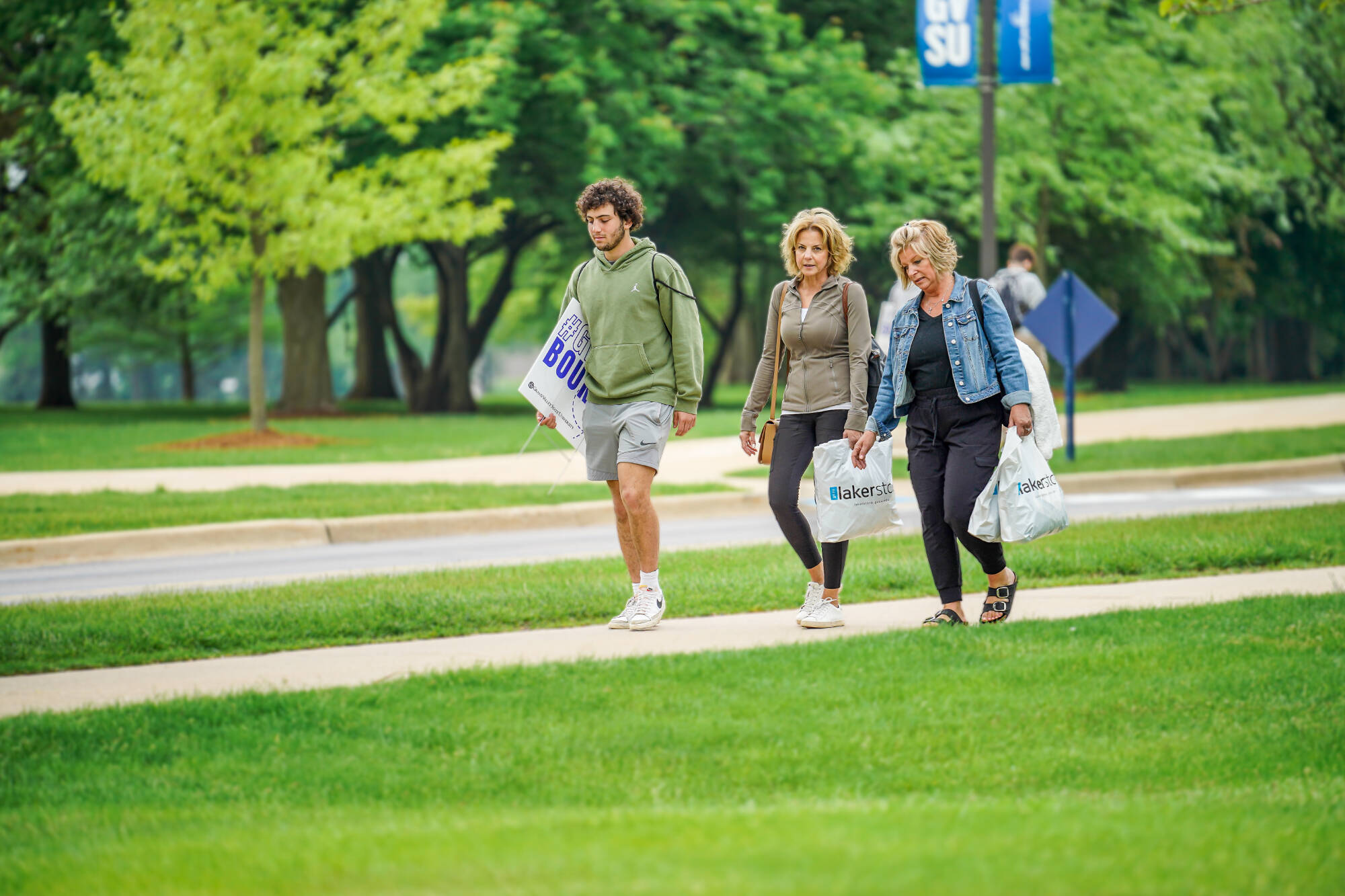 students and parents walking through campus